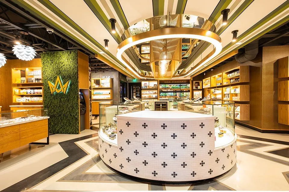 The circular flower bar beneath gold ring lights at March and Ash Mission Valley.